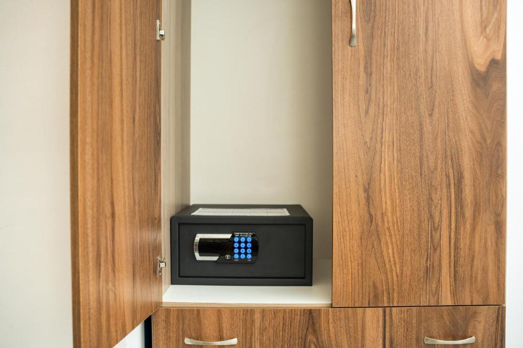 a small cabinet with a safe inside of it at Fanari Art in Ios Chora