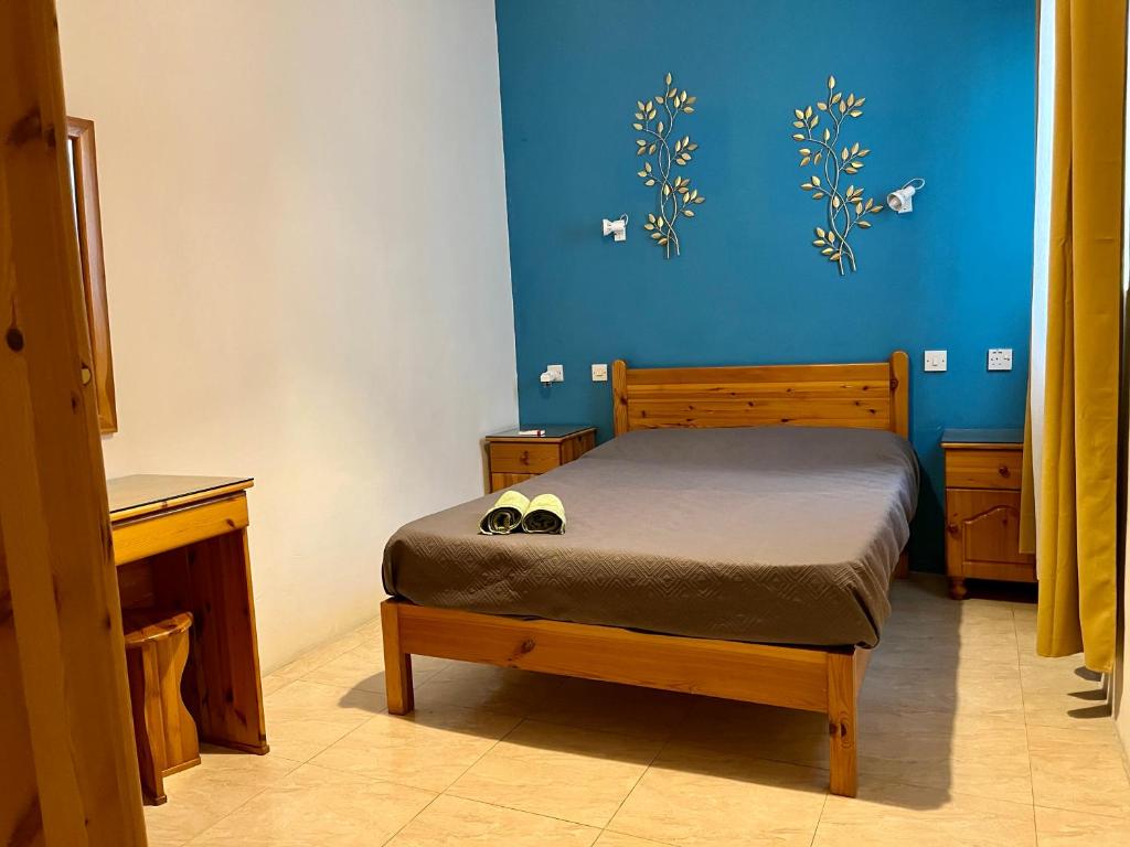 Postel nebo postele na pokoji v ubytování Gozo Belle Mare Apartments