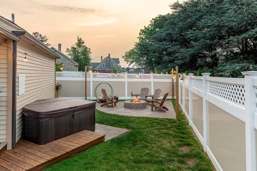 a backyard with a hot tub and a fire pit at AmishGuestCottage~cozystudio~hottub~patio in Gordonville
