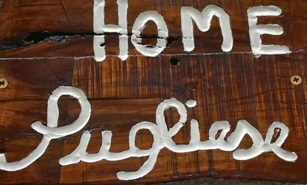 a sign that says aging on a wooden table at Home Pugliese in Ceglie Messapica