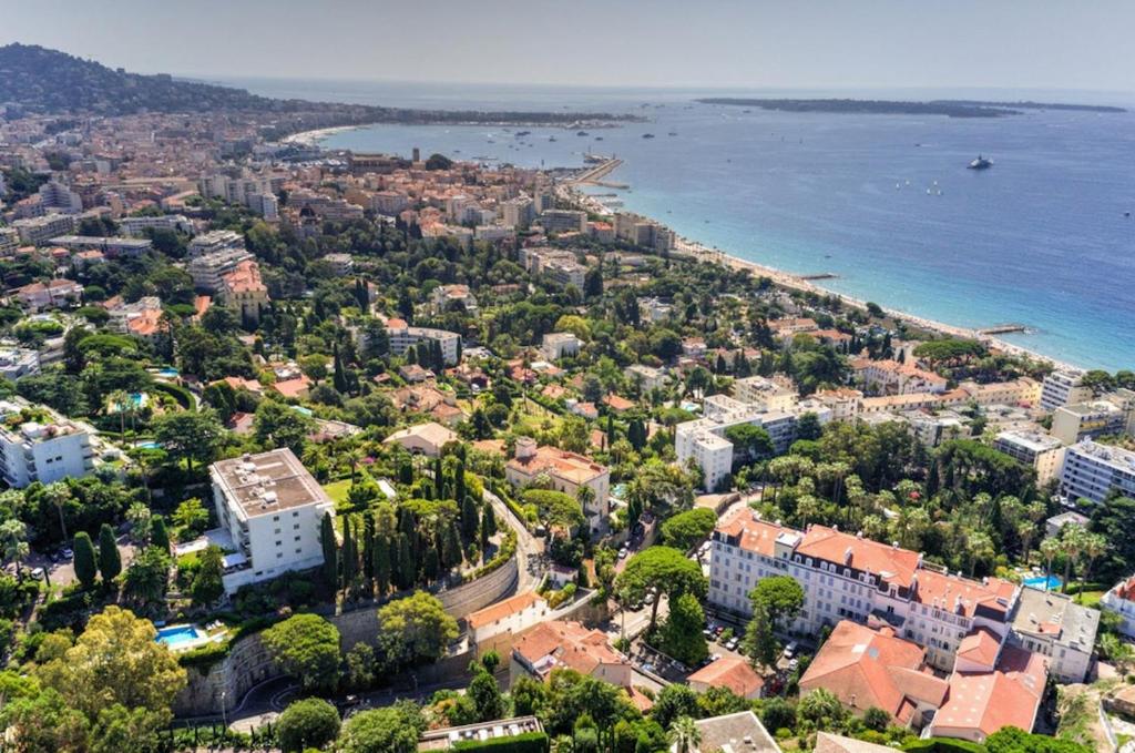 an aerial view of a city next to the water at Palais Belle Epoque - Property With Style in Cannes