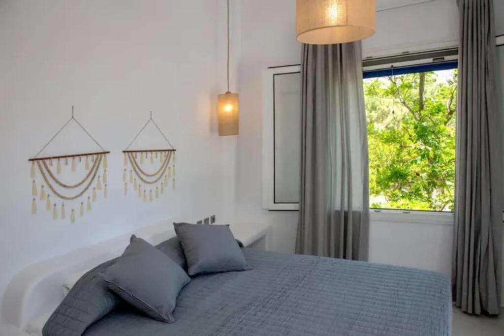 Łóżko lub łóżka w pokoju w obiekcie Beachside Villa Agios Sostis
