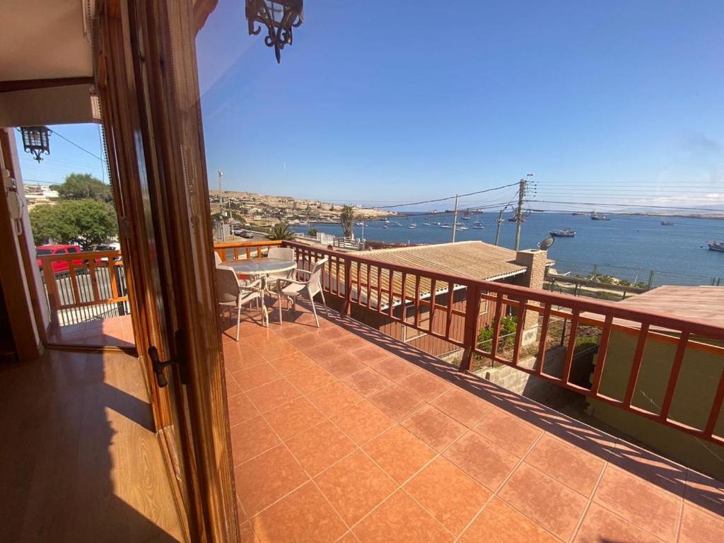 a balcony of a house with a view of the water at Casa con vista al mar en Caldera in Caldera