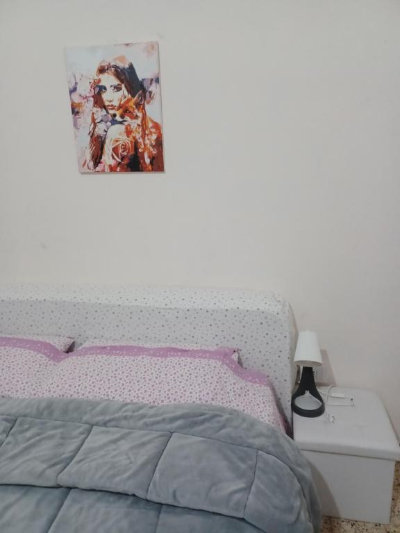 Posteľ alebo postele v izbe v ubytovaní B&B Appartamenti NAPOLI