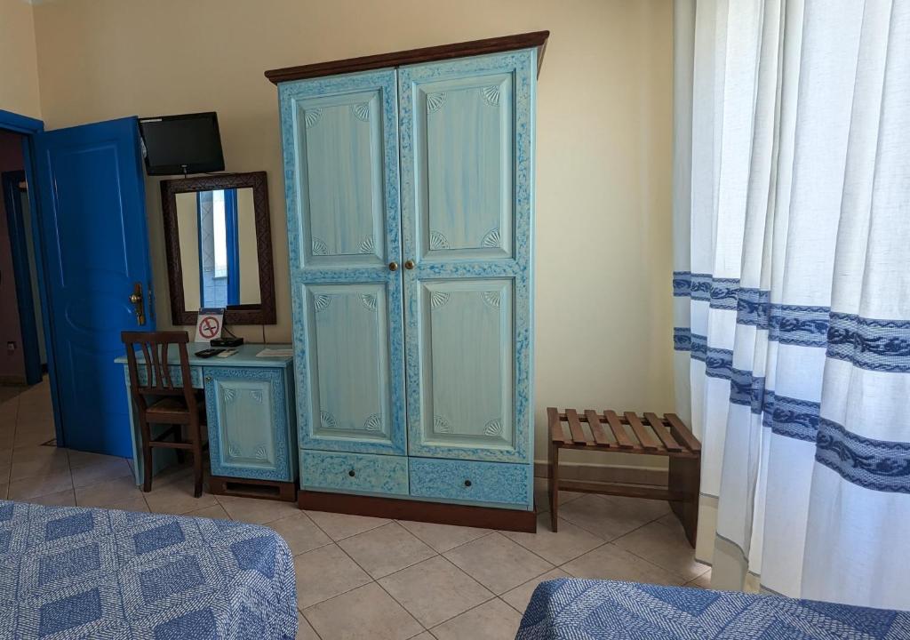 Postel nebo postele na pokoji v ubytování Hotel Aquarius