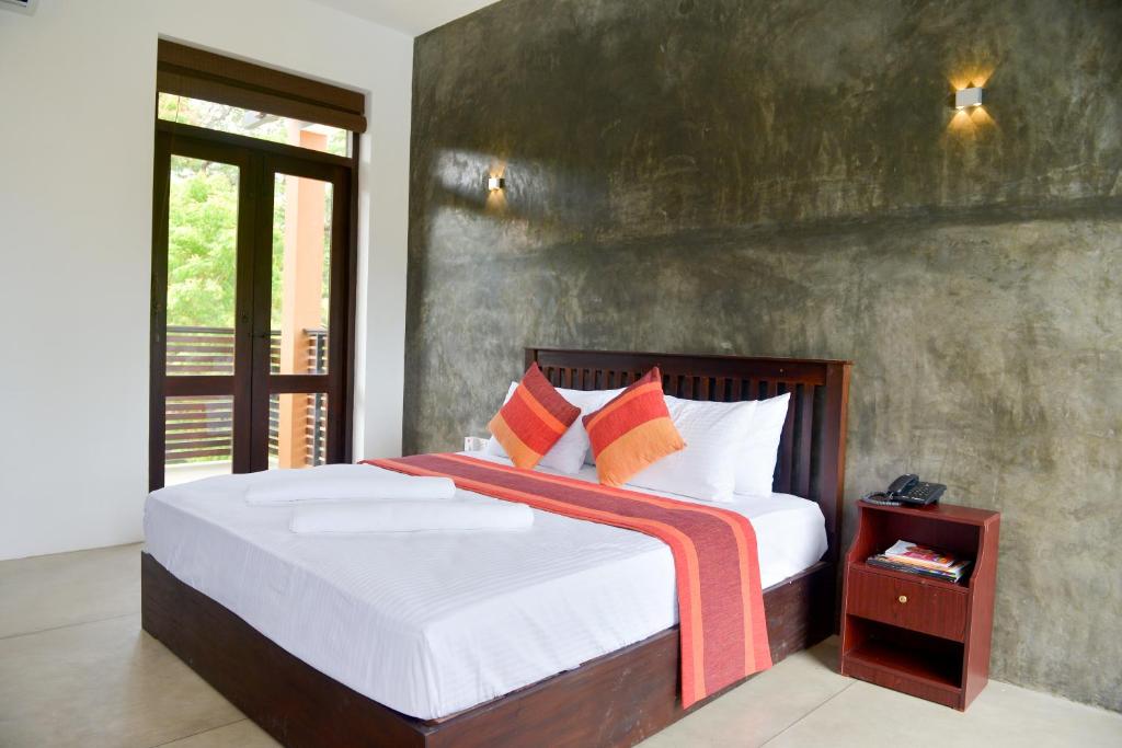 Postel nebo postele na pokoji v ubytování Olanro Hotel Negombo