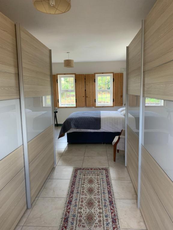 Postel nebo postele na pokoji v ubytování Heron House