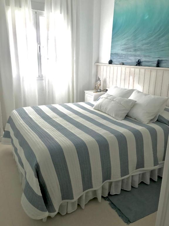 A bed or beds in a room at Apartamento DUPLEX CRUZ DEL MAR
