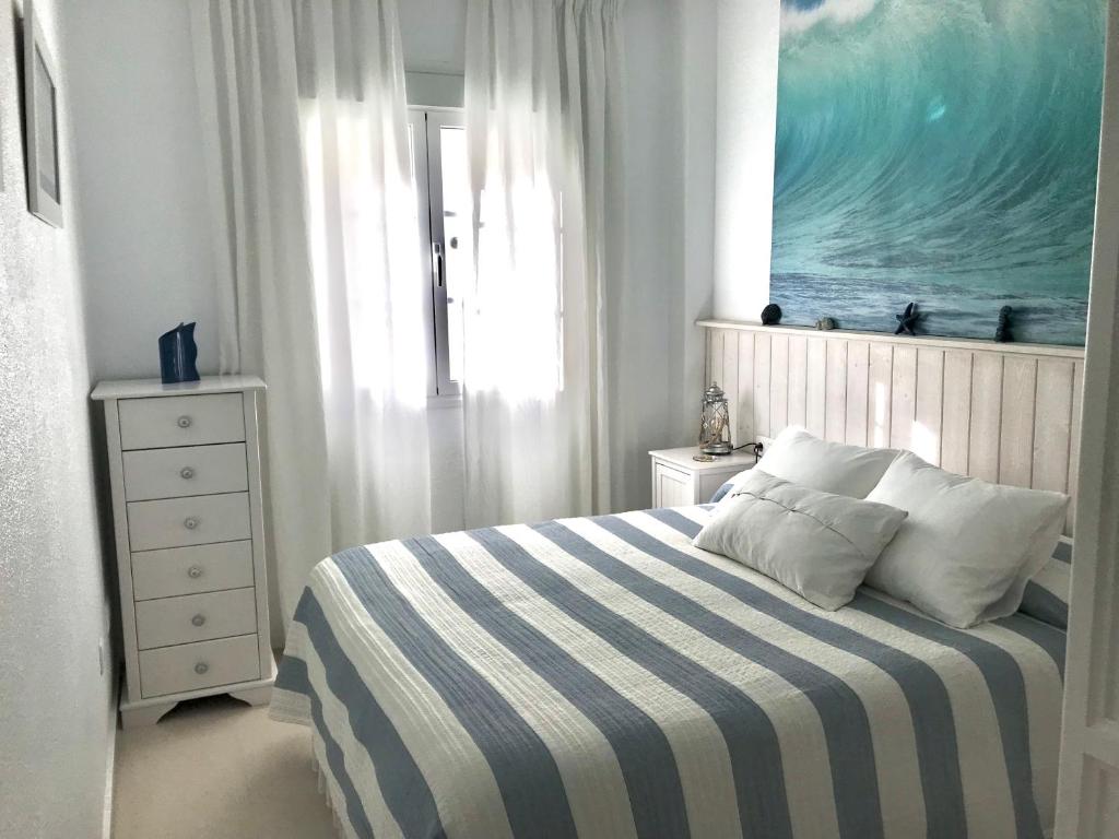 A bed or beds in a room at Apartamento DUPLEX CRUZ DEL MAR