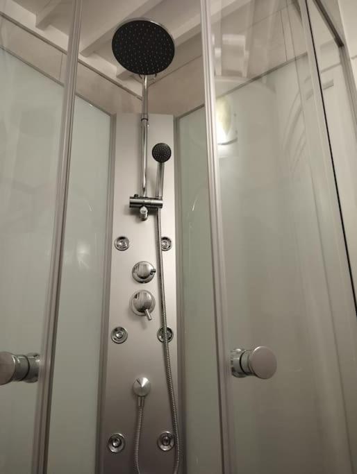 a shower in a bathroom with a shower at Le Studio de la Seine in Elbeuf