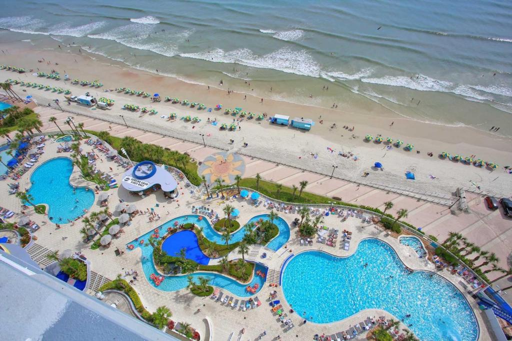 an aerial view of a resort with a beach at Luxury 16th Floor 1 BR Condo Direct Oceanfront Wyndham Ocean Walk Resort Daytona Beach | 1610 in Daytona Beach