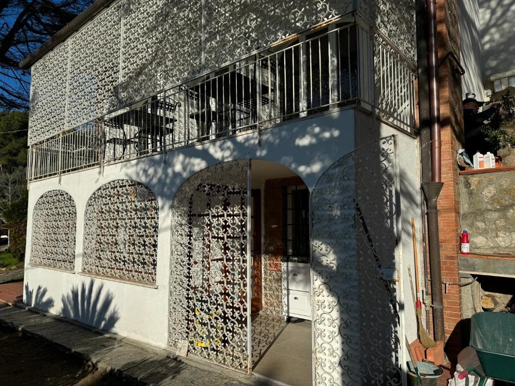a building with a wall covered in wine bottles at VILLA TARA in Quercianella