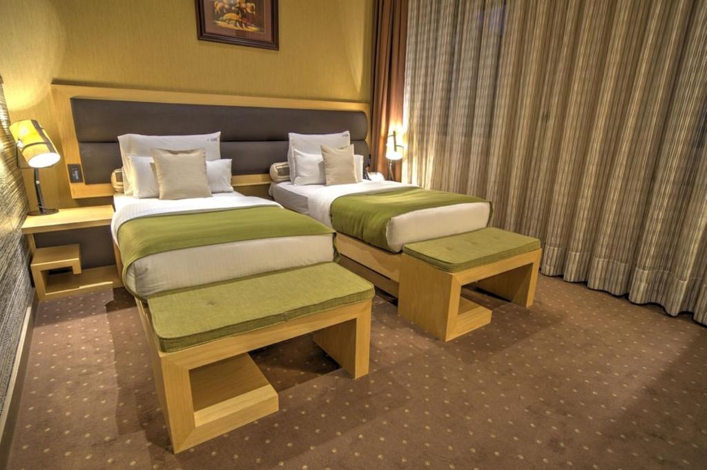 Postel nebo postele na pokoji v ubytování Atera Business Suites