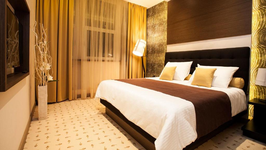 Postel nebo postele na pokoji v ubytování Atera Business Suites