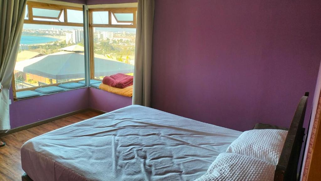 En eller flere senge i et værelse på casa en la herradura coquimbo