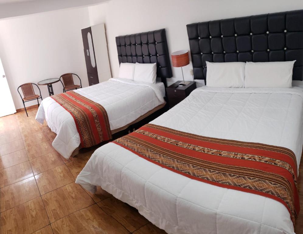 Ένα ή περισσότερα κρεβάτια σε δωμάτιο στο Cusco de mis Sueños Hostal - II