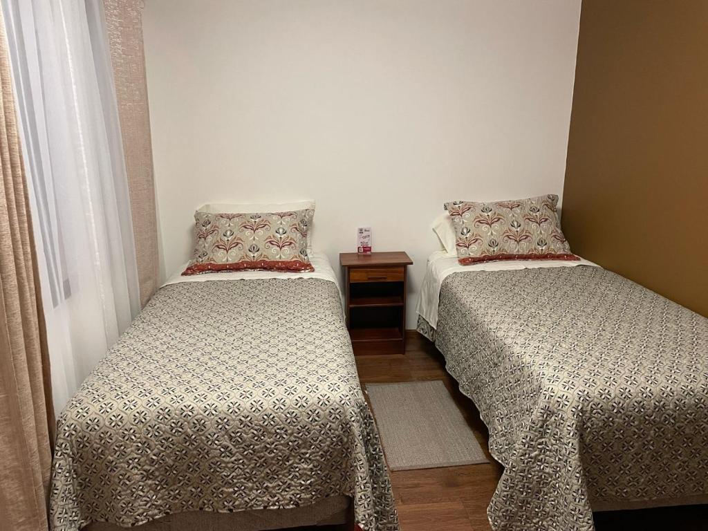 Postel nebo postele na pokoji v ubytování Hostal doña irene