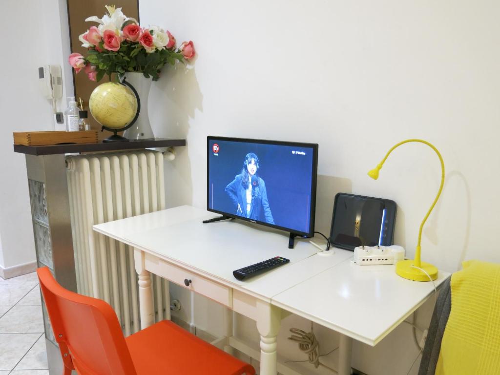 Televízia a/alebo spoločenská miestnosť v ubytovaní Thany casa