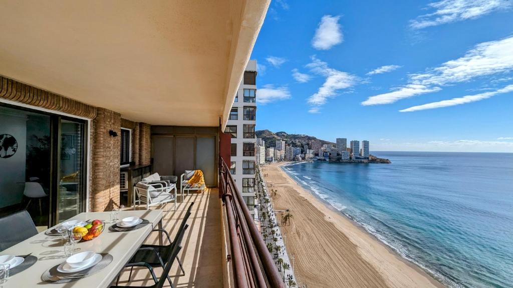 a balcony with a view of a beach and the ocean at LAS ARENAS superior seafront in Benidorm