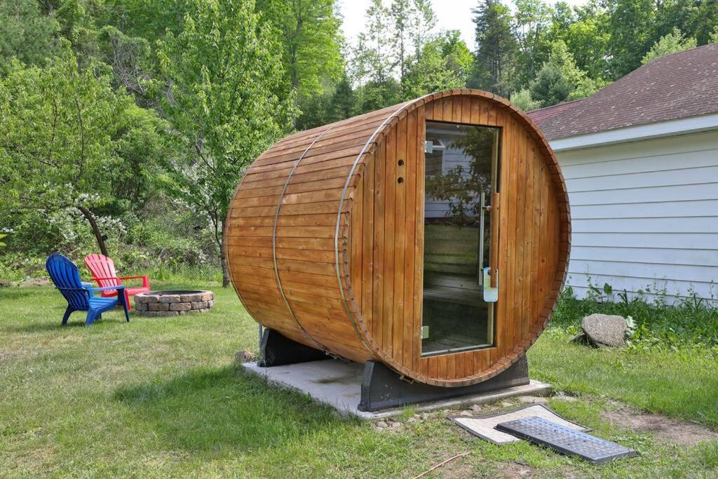 un gran barco de madera sentado junto a una casa en Catskills Hideaway w Sauna Minutes from Skiing, en Mount Tremper