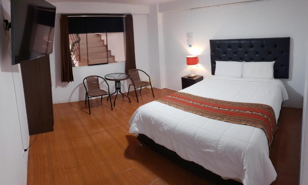 Ένα ή περισσότερα κρεβάτια σε δωμάτιο στο Cusco de mis Sueños Hostal - II