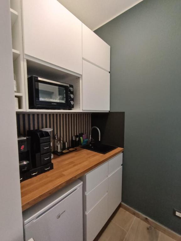 Kuchyň nebo kuchyňský kout v ubytování B&B Regina 381