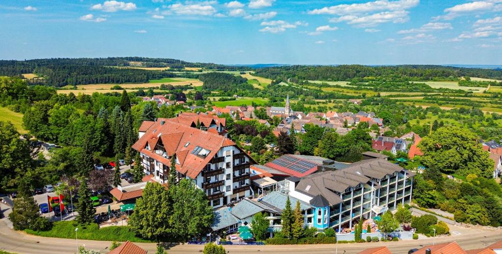 an aerial view of a town with a building at Vital- und Wellnesshotel Albblick in Waldachtal