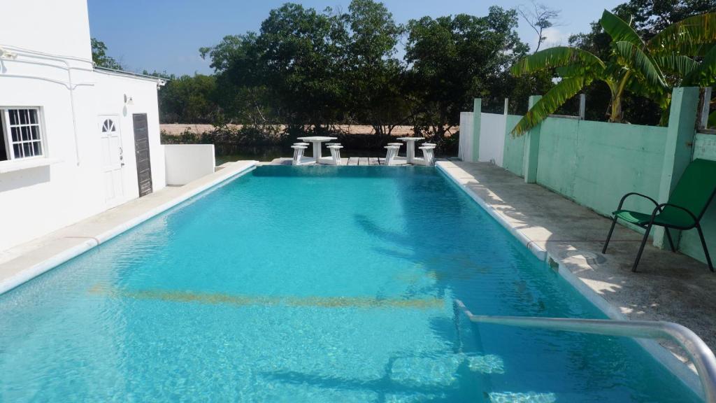 a swimming pool with blue water in a building at See Belize Sea View Vacation Rentals in Belize City
