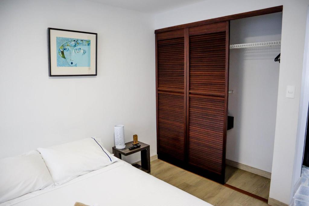 Voodi või voodid majutusasutuse Apartahotel La Arboleda HC toas