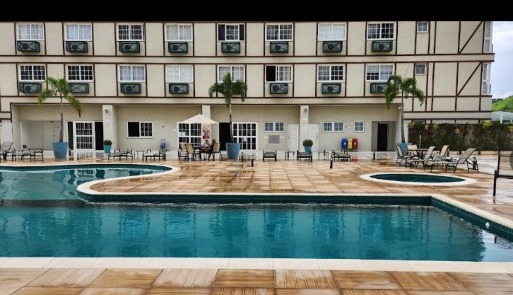 Bazén v ubytování STUDIO ALTO PADRÃO ITAIPAVA nebo v jeho okolí