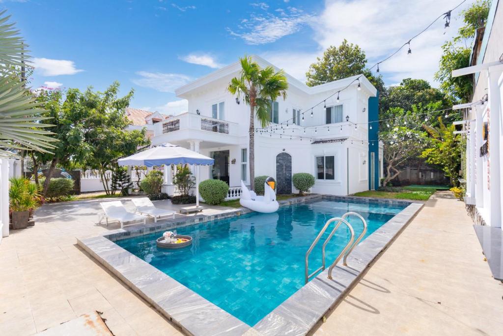 a swimming pool in the backyard of a house at Ruby Villa in Vung Tau