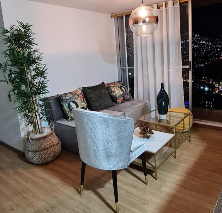 a living room with a couch and a table at Casalba in Bello