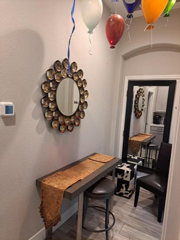 a dining room with a mirror and balloons on the wall at Roseville Properties in Roseville