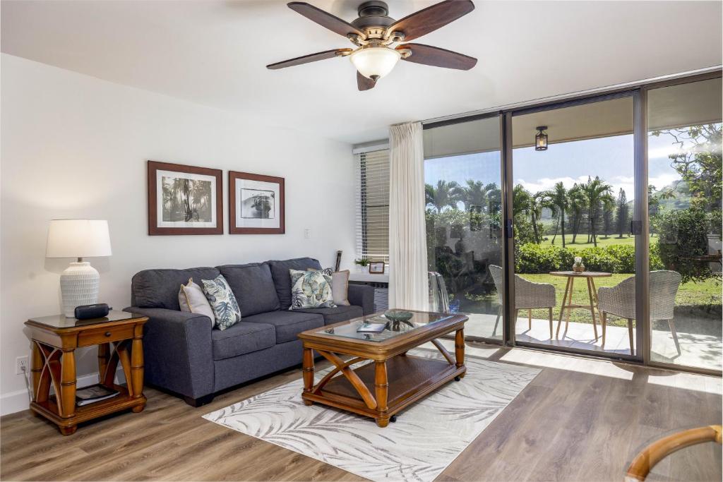 a living room with a couch and a table at Turtle Bay Kuilima Resort East condo in Kahuku