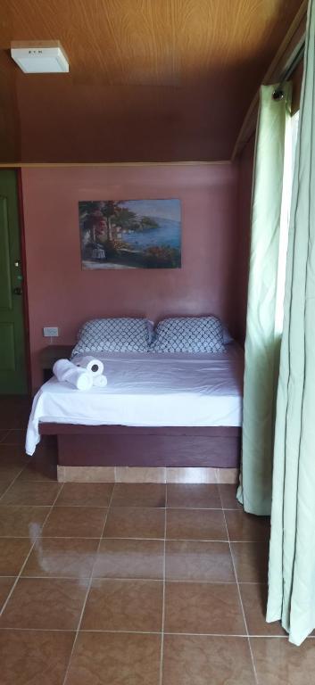 Postel nebo postele na pokoji v ubytování Ofiuras Hostal