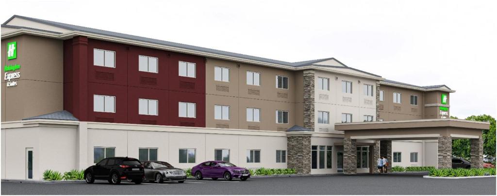two cars parked in front of a hotel at Holiday Inn Express Redding North by IHG in Redding