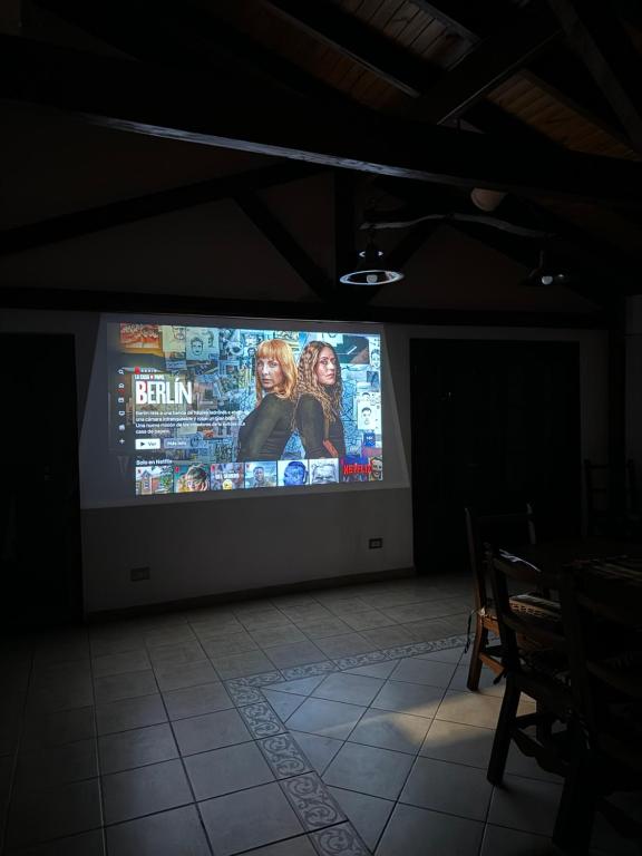 a large screen on a wall in a room at El Sosiego in Villa de Las Rosas