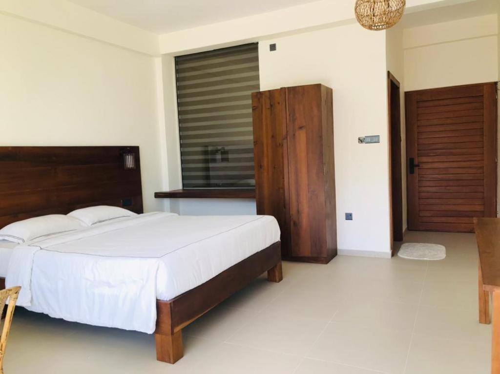 Postel nebo postele na pokoji v ubytování Mandara Mount Hotel