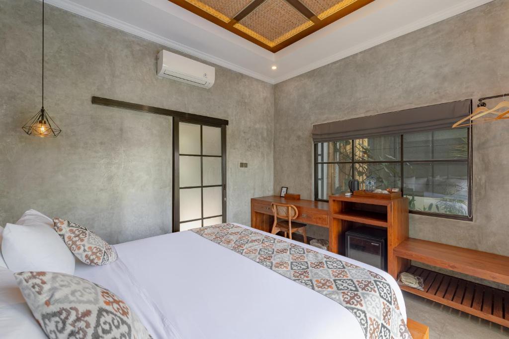 Postel nebo postele na pokoji v ubytování VILLARIZ Ubud , Bali