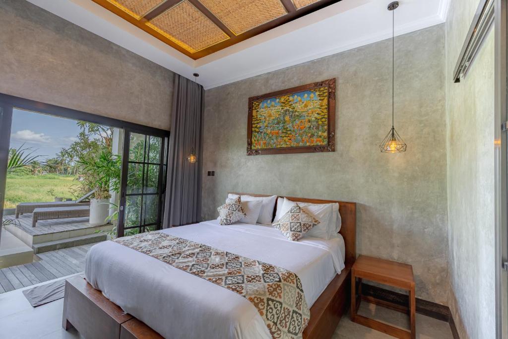 Postel nebo postele na pokoji v ubytování VILLARIZ Ubud , Bali