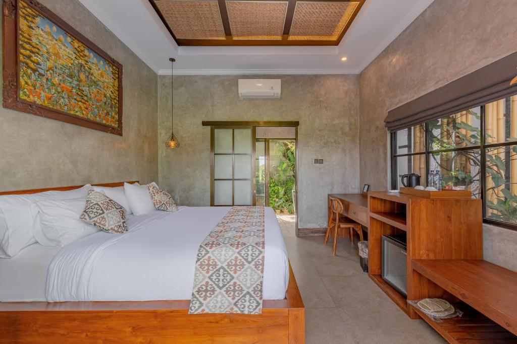 Postel nebo postele na pokoji v ubytování VILLARIZ Ubud , Bali