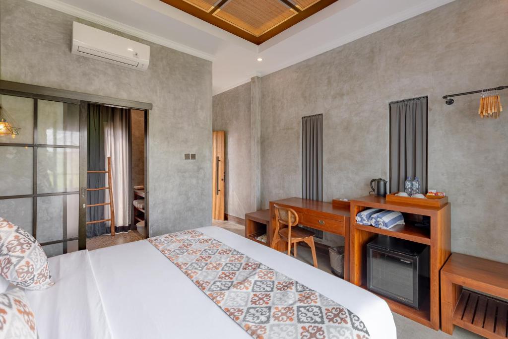 Postel nebo postele na pokoji v ubytování VILLARIZ Ubud , Bali