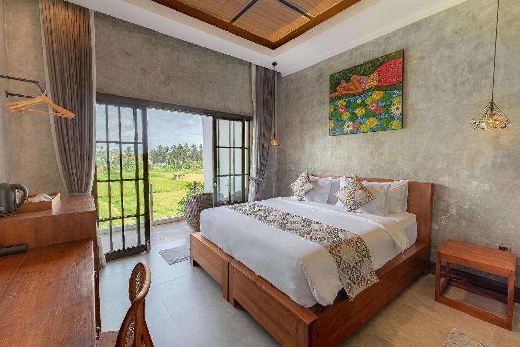 Postel nebo postele na pokoji v ubytování VILLARIZ Ubud , Bali