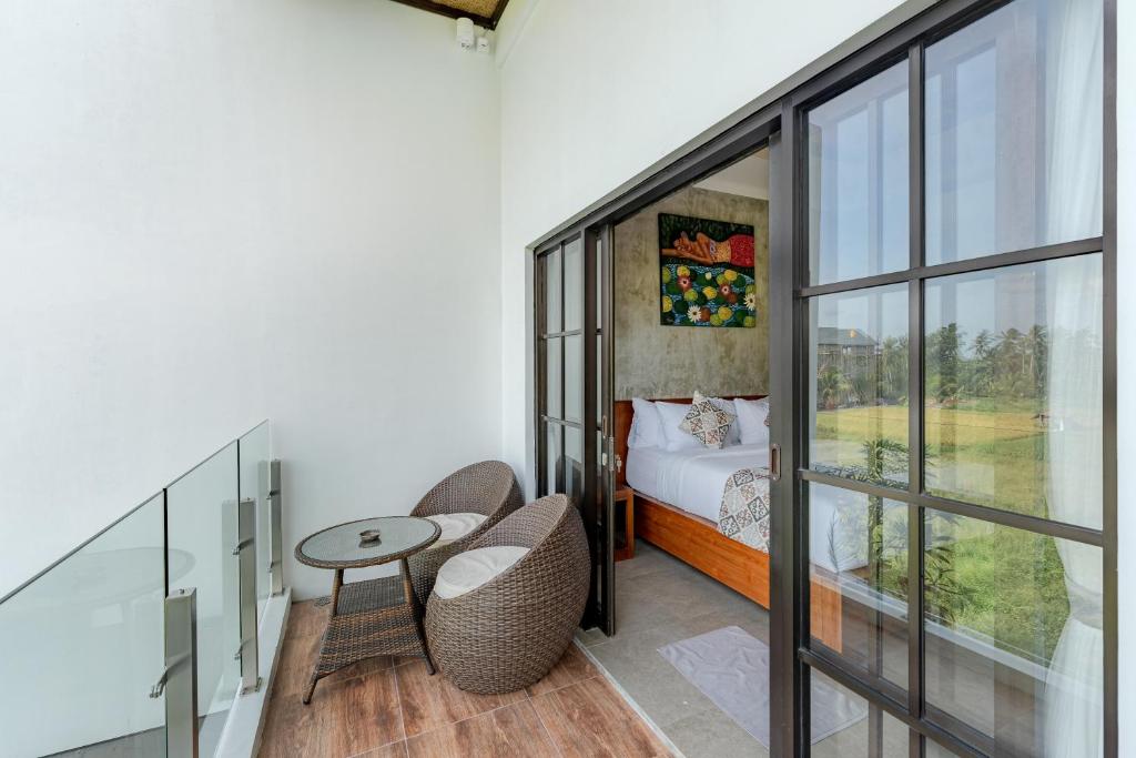 Postel nebo postele na pokoji v ubytování VILLARIZ Ubud , Bali