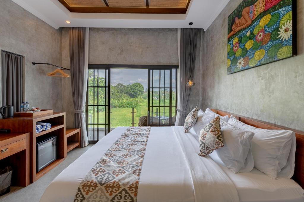 Postel nebo postele na pokoji v ubytování VILLARIZ Ubud , Bali