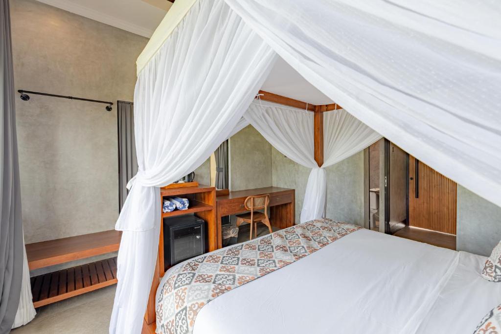 Postel nebo postele na pokoji v ubytování VILLARIZ Ubud , Bali