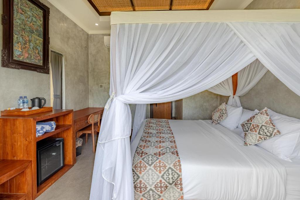 Postel nebo postele na pokoji v ubytování VILLARIZ Ubud , Bali