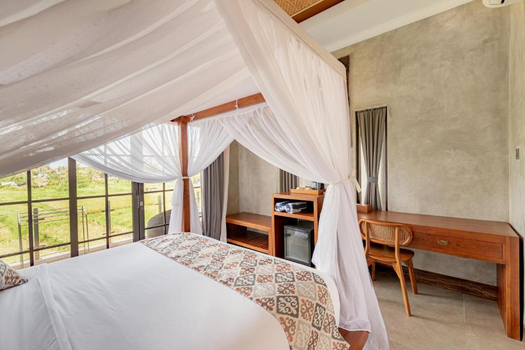Postel nebo postele na pokoji v ubytování VILLARIZ Ubud , Bali
