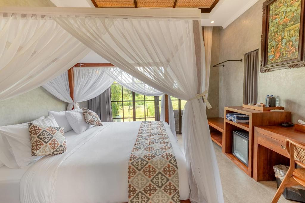 Postel nebo postele na pokoji v ubytování VILLARIZ Ubud , Bali