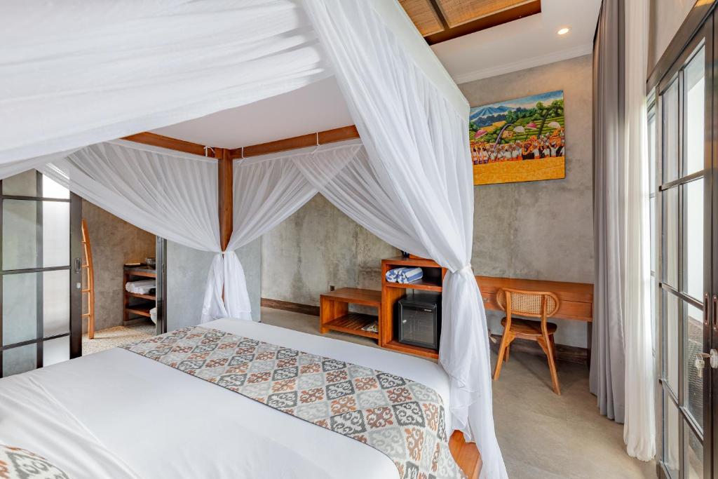 Postel nebo postele na pokoji v ubytování VILLARIZ Ubud , Bali